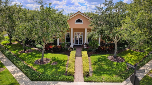 view of front of property featuring french doors and a front yard