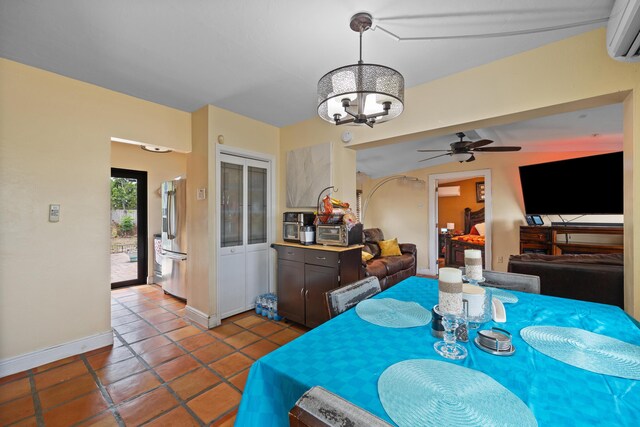 dining room with light tile patterned flooring, a wall mounted AC, and ceiling fan with notable chandelier