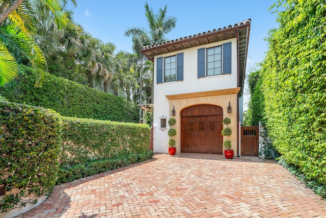 view of front of home with a garage