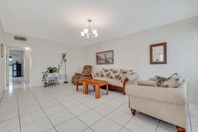 tiled living room featuring a notable chandelier