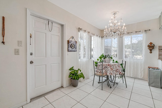 dining space with an inviting chandelier and light tile flooring