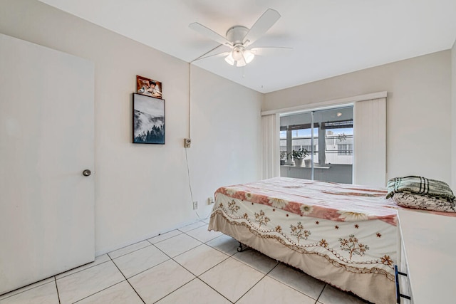 tiled bedroom featuring ceiling fan