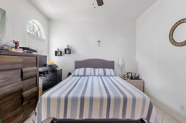 bedroom with light tile patterned floors and ceiling fan