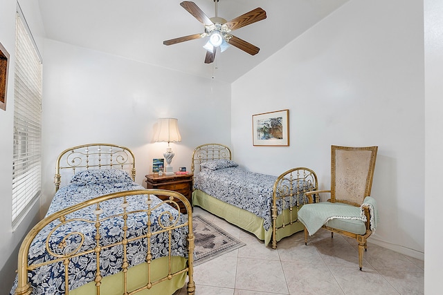 bedroom with light tile patterned flooring, lofted ceiling, and ceiling fan