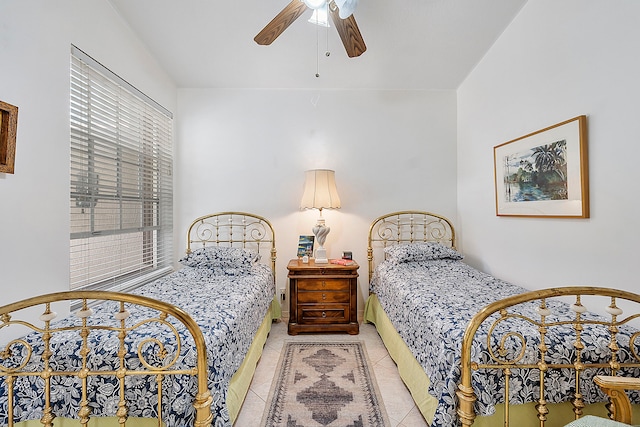 bedroom with light tile patterned floors and ceiling fan