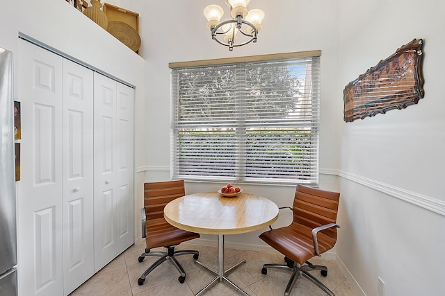 tiled dining area with a notable chandelier