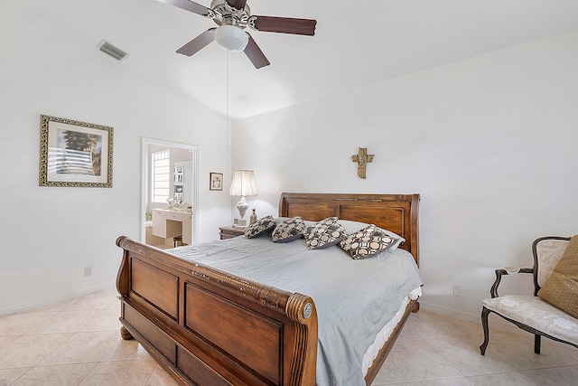 tiled bedroom with connected bathroom, vaulted ceiling, and ceiling fan