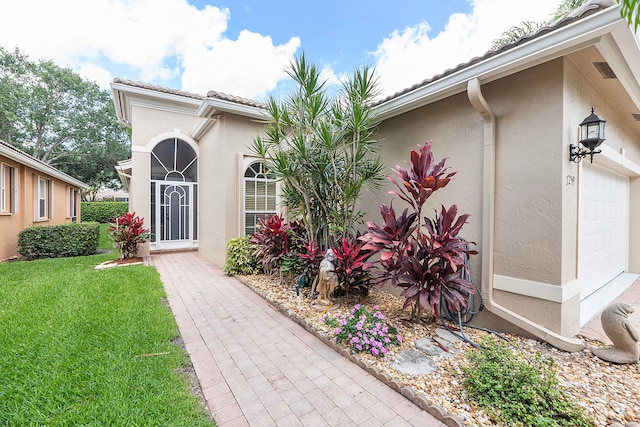 view of front facade with a garage and a front lawn