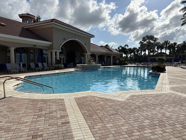 view of swimming pool featuring a patio