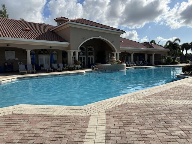 view of pool featuring a patio