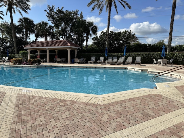 view of swimming pool with a patio area