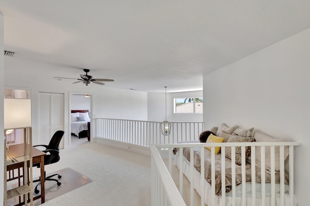 home office featuring ceiling fan and carpet flooring