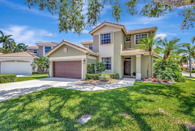 mediterranean / spanish-style home with a garage and a front yard