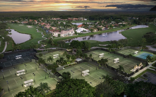 aerial view at dusk with a water view