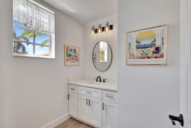 bathroom featuring hardwood / wood-style floors and vanity