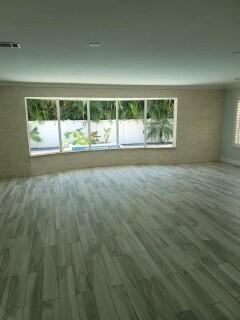 empty room with dark wood-type flooring