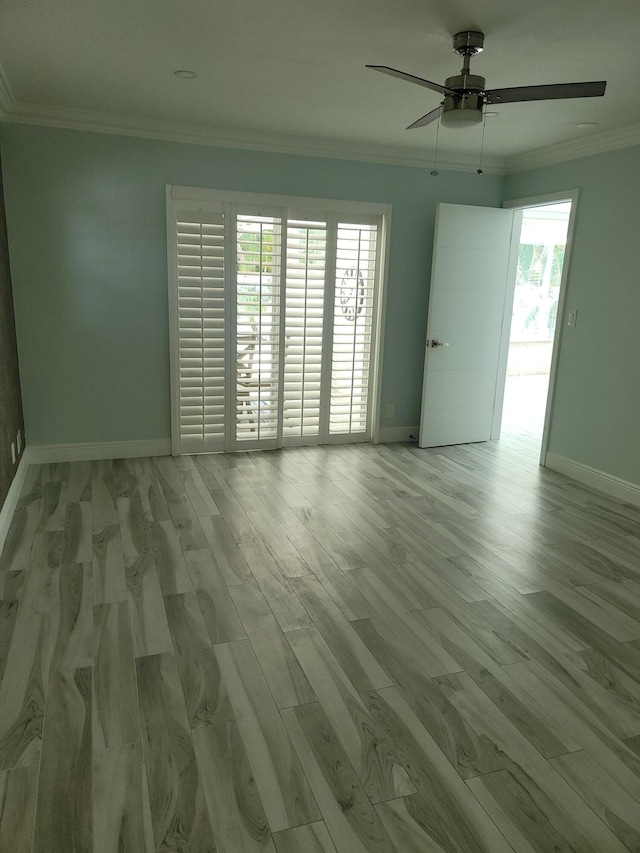 spare room featuring ceiling fan, crown molding, and hardwood / wood-style flooring