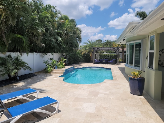 view of pool with a pergola and a patio area