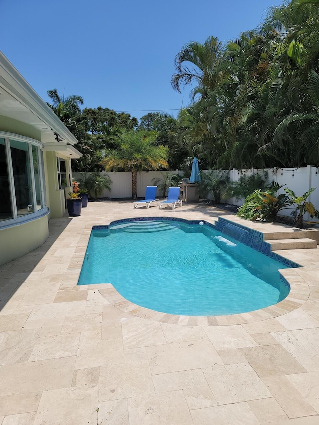 view of pool featuring a patio area and pool water feature