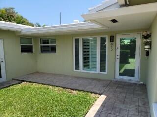 rear view of property featuring a patio area