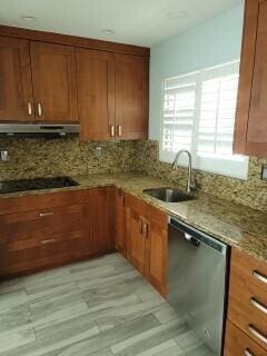 kitchen featuring ventilation hood, light stone countertops, backsplash, sink, and stainless steel dishwasher