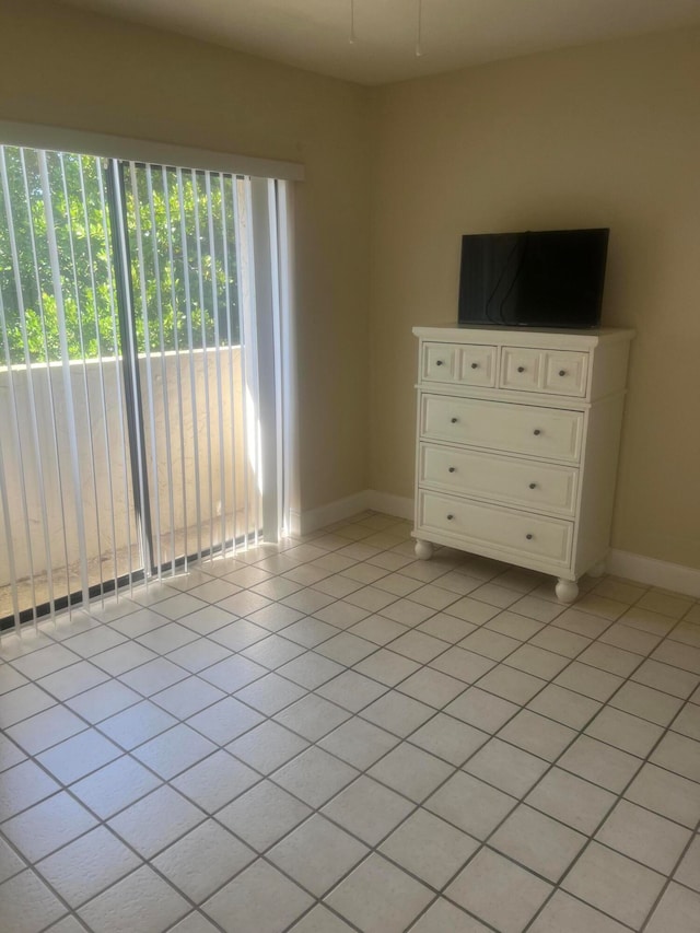 unfurnished bedroom with light tile patterned floors