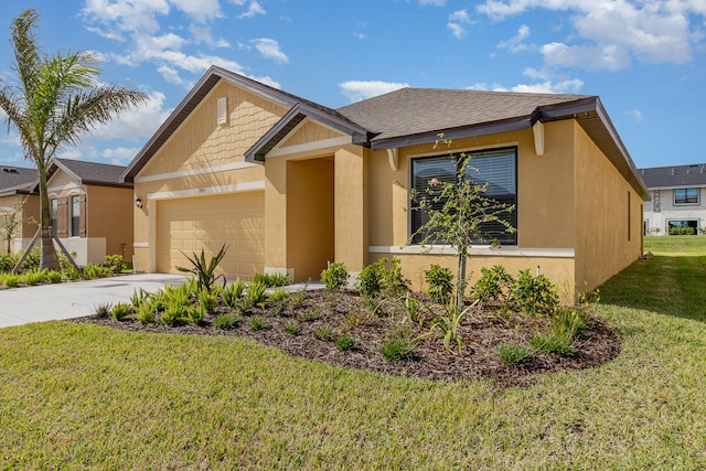 view of front of house featuring a front lawn and a garage