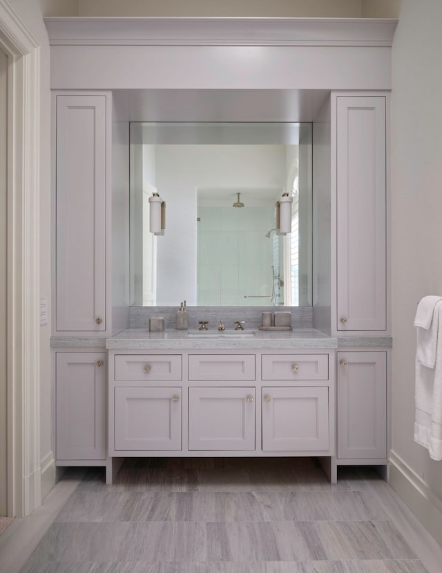 bathroom featuring tile floors and vanity