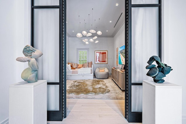 interior space with crown molding and hardwood / wood-style floors