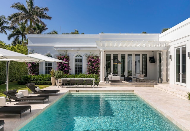 view of swimming pool with a patio area, a pergola, and outdoor lounge area