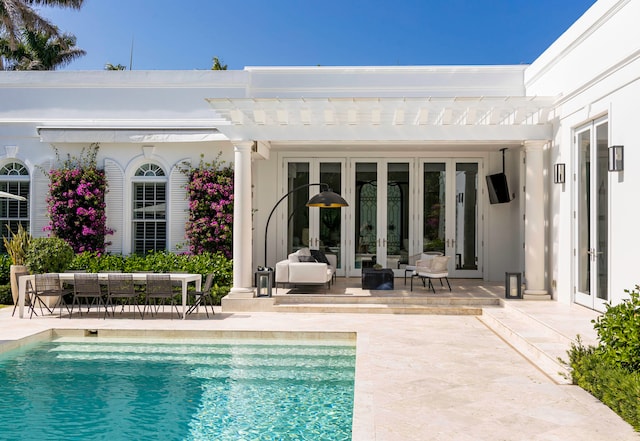 view of swimming pool featuring a pergola, outdoor lounge area, and a patio