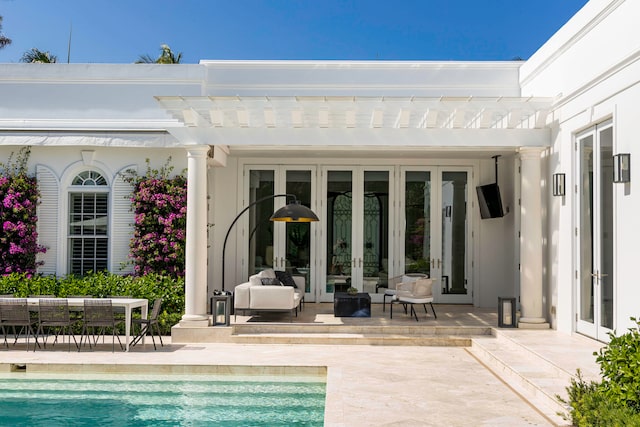 view of pool with a pergola, a patio area, and french doors