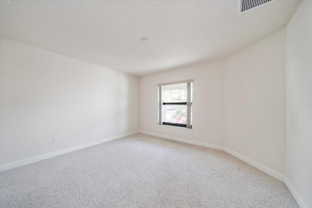 unfurnished room featuring carpet flooring