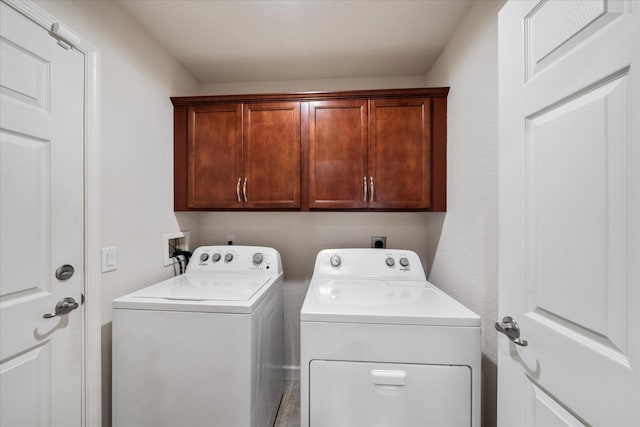 laundry area with washer and dryer, cabinets, hookup for an electric dryer, and washer hookup