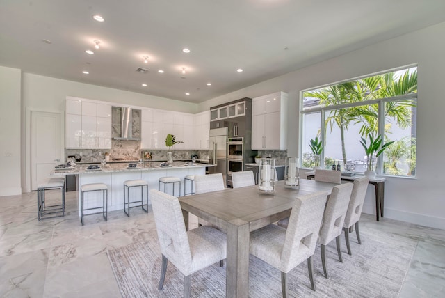 dining room with light tile patterned flooring