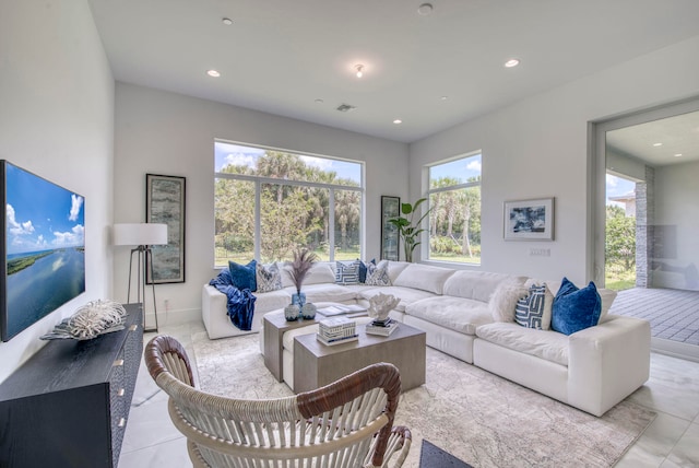 tiled living room with plenty of natural light