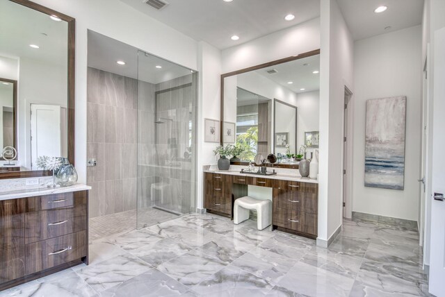 bathroom with vanity, a shower with door, and tile patterned flooring