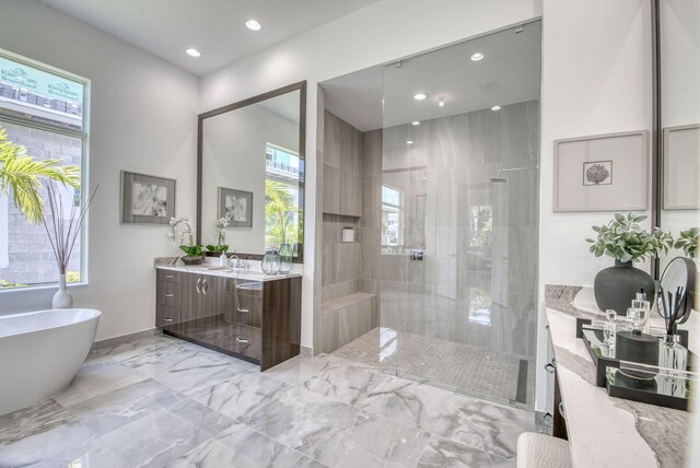 bathroom featuring tile patterned floors, vanity, and independent shower and bath