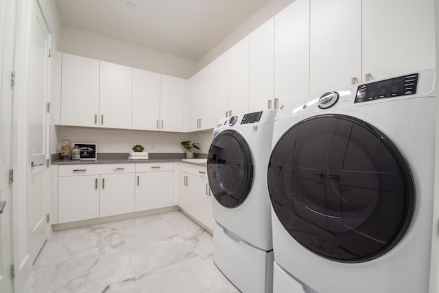 laundry room with marble finish floor, cabinet space, and independent washer and dryer