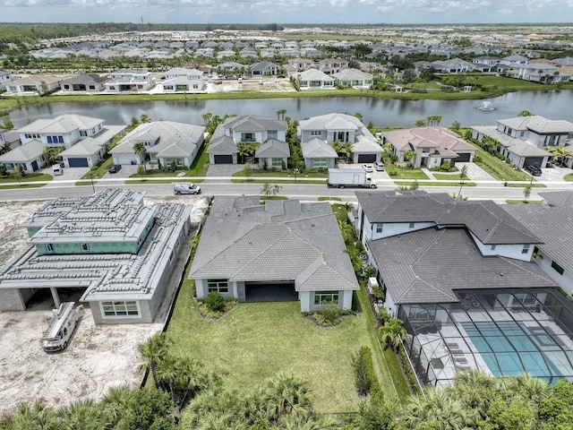 bird's eye view with a water view and a residential view