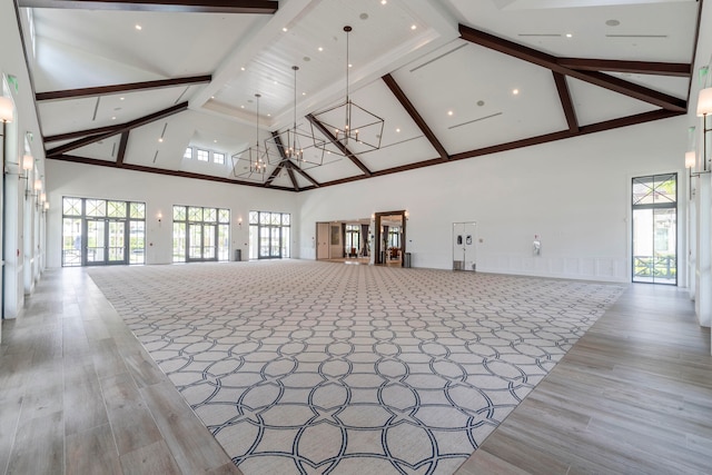 interior space featuring high vaulted ceiling, light hardwood / wood-style flooring, and a wealth of natural light