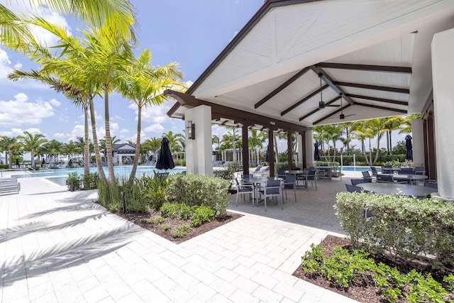 view of property's community featuring a pool, a patio, and a gazebo