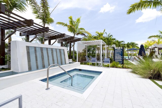 view of swimming pool featuring a pergola, a patio, and a hot tub