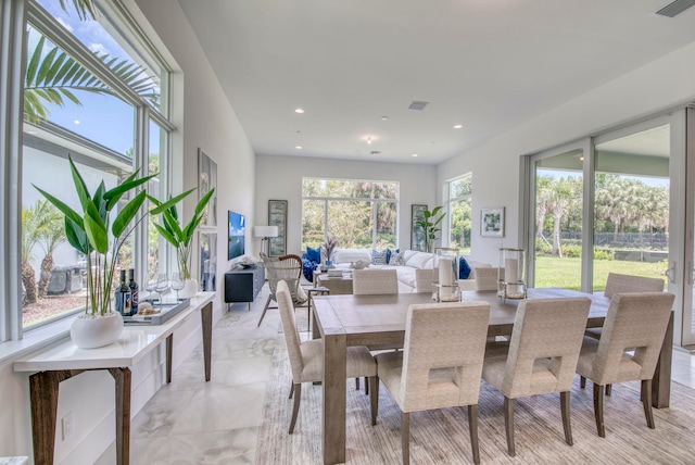 dining area featuring light tile patterned floors