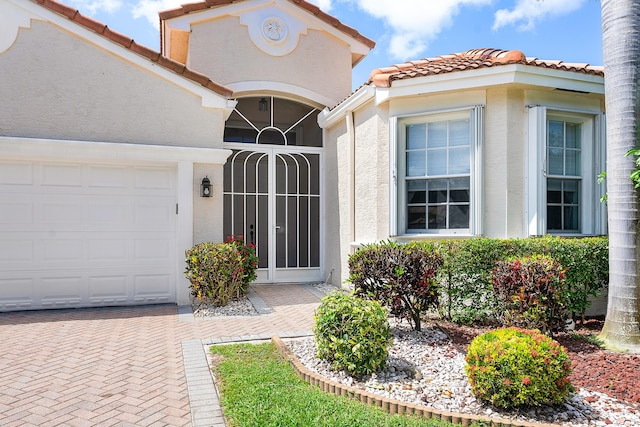 property entrance with a garage