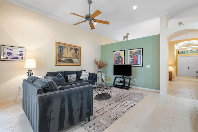 tiled living room featuring crown molding and ceiling fan