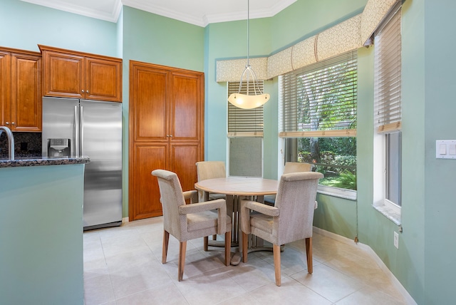 tiled dining space with ornamental molding