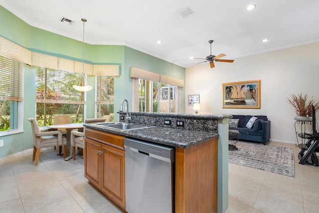 kitchen featuring decorative light fixtures, sink, dark stone counters, a kitchen island with sink, and stainless steel dishwasher