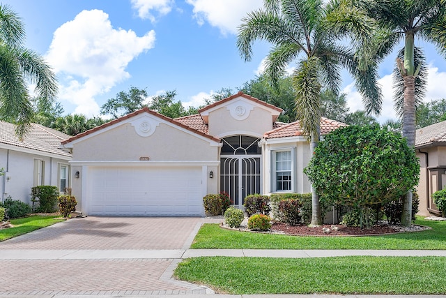 mediterranean / spanish house with a garage