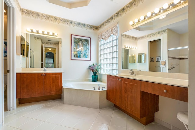 bathroom featuring tile patterned flooring, plus walk in shower, and vanity